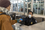 CBP Officers at the San Ysidro Port of Entry, PED WEST facility, use Personal Protective Equipment (PPE) to and social distancing to protect themselves and the people they encounter from COVID-19. Mani Albrecht